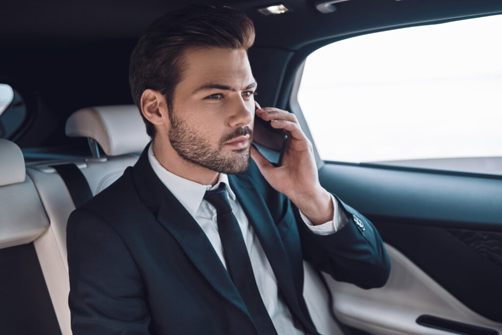 Passenger riding in luxury chauffeur limo — Elite Executive Limos South Florida